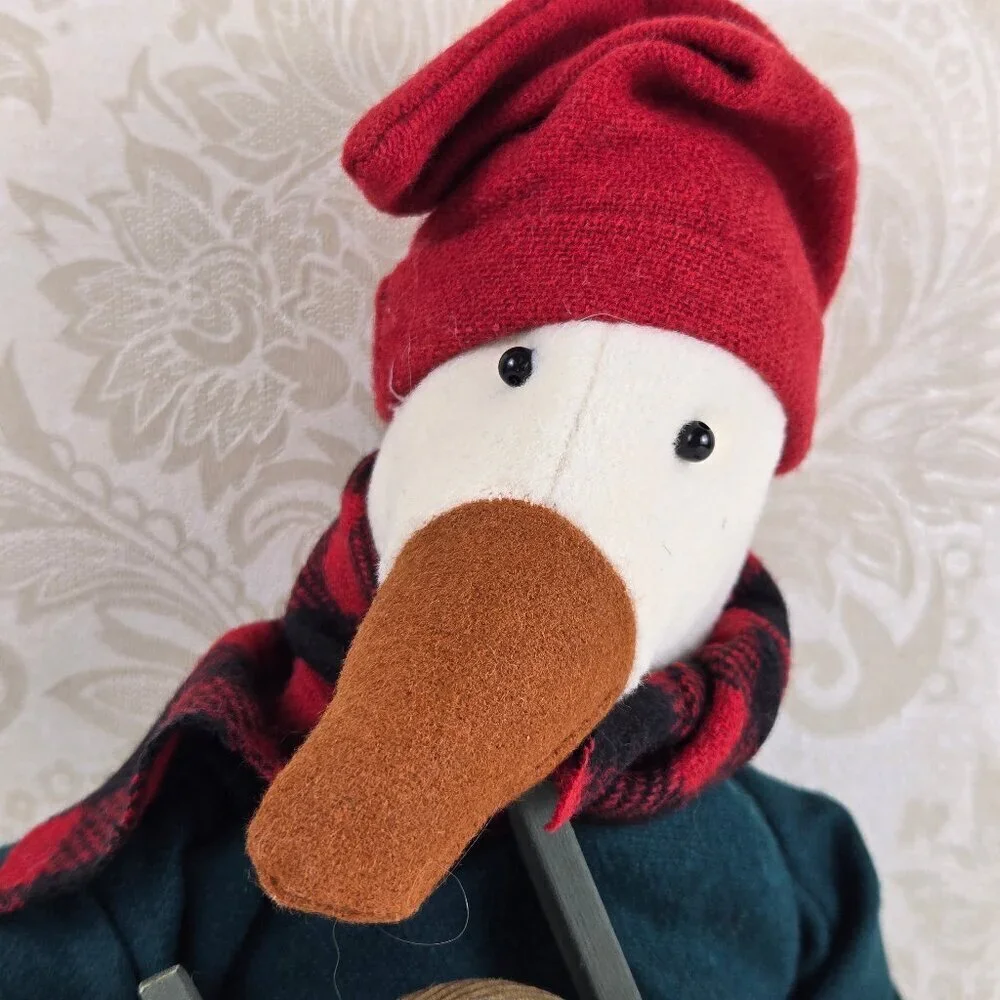 Stuffed Goose in Winter Attire Holding 